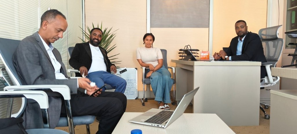 YOSAM team members collaborating in a bright office environment